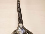 an image of a metal animal head mounted on a wall