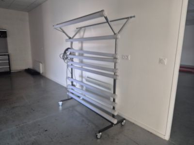 an image of a room with a clothes rack in it