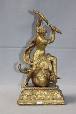 brass figurine of a woman holding a sword and sitting on top of an elephant