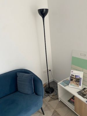 a blue couch and a table in a room