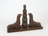 wooden table lamp with two birds on top of it on a stand