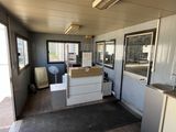 a kitchen with a sink and a refrigerator inside of it