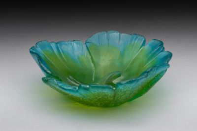 a glass bowl that is sitting on a table