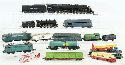 a lot of toy trains on display on a white surface
