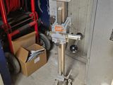 a machine that is sitting on a stand in a garage