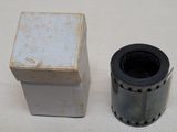 a roll of film next to a box on a table