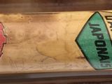 a close up of a baseball bat with stickers on it
