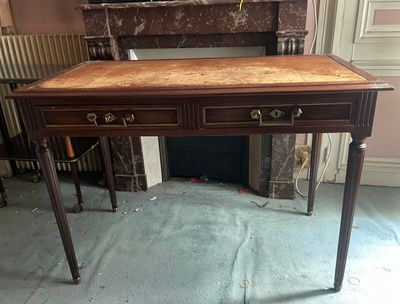 a desk with a drawer on it in a room