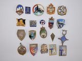 several different types of badges are displayed on a white surface