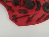 a lot of different items that are on a red cloth