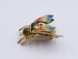 a small insect that is sitting on top of a white surface