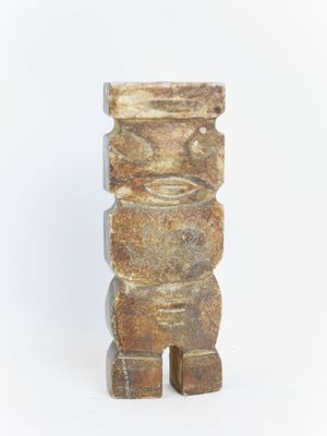 sculpture of a totema made of stone on a white background
