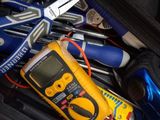 a suitcase full of tools and a cell phone in it