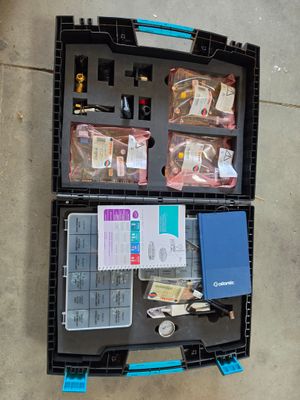 a black case with a lot of items inside of it