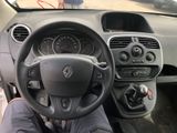 dashboard of a car with a person sitting in the driver ' s seat