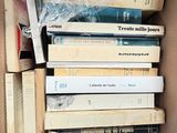 a box full of books sitting on top of each other