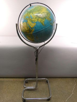 a small blue and yellow globe on a metal stand