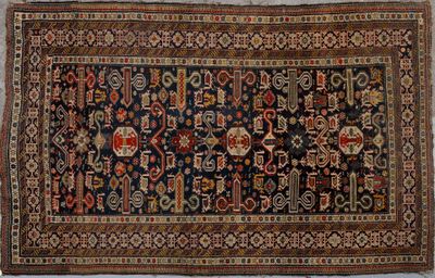 tapis persan ancien à motifs bleus et rouges
