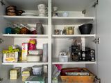 a cabinet with a lot of food and drinks on it
