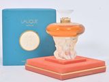 an image of a perfume bottle sitting on top of a box