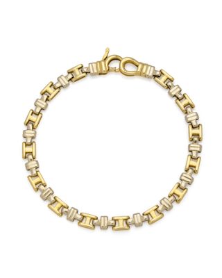 un bracelet en or et en argent à maillons carrés
