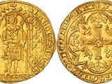 a gold coin with an image of a man holding a cross