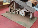 a small model of a house on a table