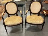 pair of antique chairs with upholstered back and arms