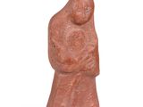 figurine of a woman holding a child in her arms