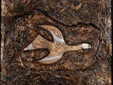 a close up of a painting of a bird on a piece of wood