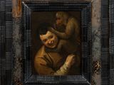 un vieux tableau représentant un homme tenant un singe dans ses bras