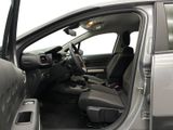 the interior of a car with the door open and the driver ' s seat down