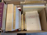 a box full of books sitting on the floor