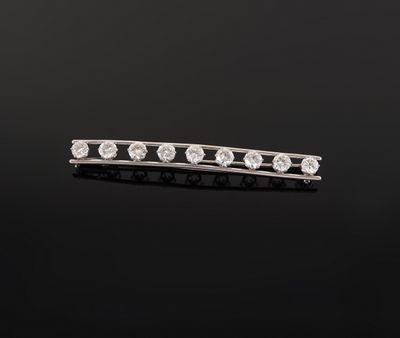 a diamond bar broocher, by cartier