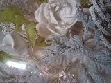 a picture of a cake with flowers and pearls on it