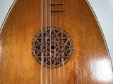 a close up of a wooden instrument on a table