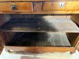 a wooden cabinet with a drawer on top of it