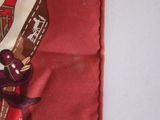 a red scarf with a picture of a woman in a red dress
