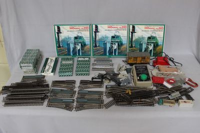 a table with a lot of train tracks and other items