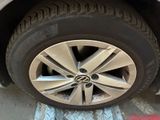 a close up of a car tire on the ground