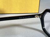 a close up of a pair of glasses with a box in the background