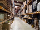 many boxes on the shelves in the warehouse