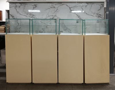 a lot of glass cases that are in a room