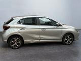 the silver car is parked in a room with a white wall