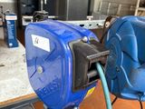 a blue machine that is sitting on a table
