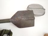 a shovel and a pair of binoculars next to a pair of binoculars