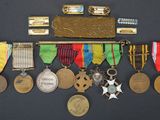 many medals and medals on display on a black surface