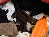 an image of a pile of clothes in a suitcase