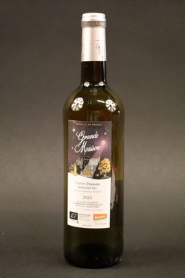 a bottle of wine that is sitting on a table