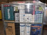 a metal cart with several boxes on it in a warehouse